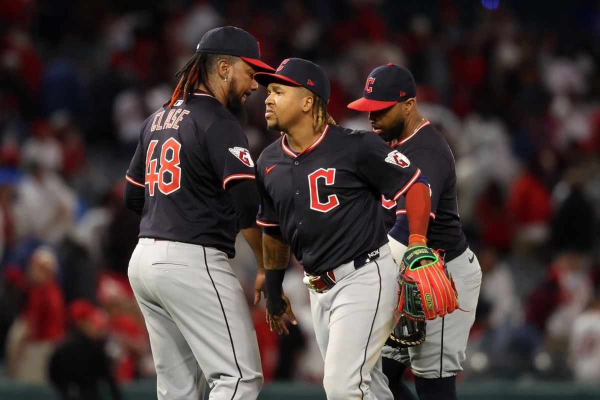Apr 4, 2025; Anaheim, California, USA;  Cleveland Guardians third baseman Jose Ramirez (11, center) celebrates a win with pitcher Emmanuel Clase (48) after defeating the Los Angeles Angels at Angel Stadium. Mandatory Credit: Kiyoshi Mio-Imagn Images