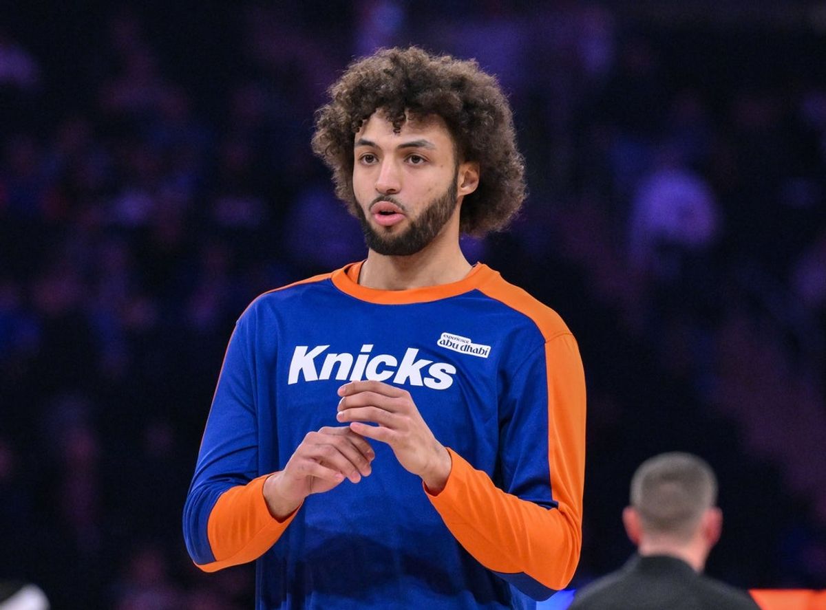 Apr 1, 2025; New York, New York, USA; New York Knicks forward Anton Watson (21) warms up before a game against the Philadelphia 76ers at Madison Square Garden. Mandatory Credit: John Jones-Imagn Images