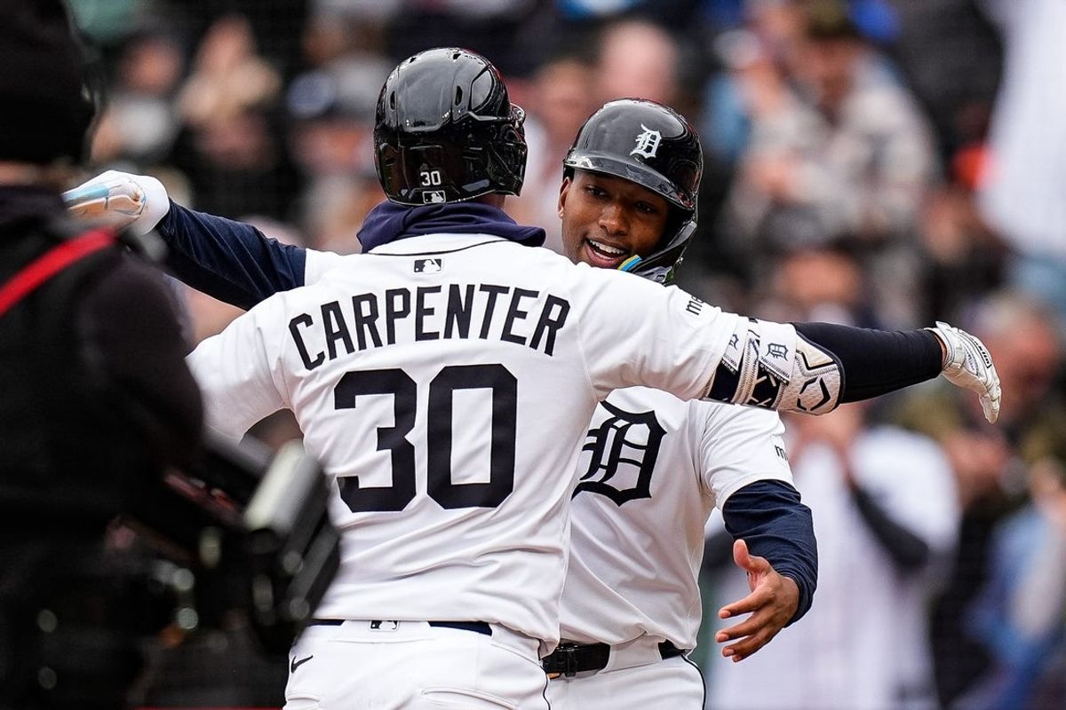 Detroit Tigers right fielder Kerry Carpenter (30) hugs designated hitter Justyn-Henry Malloy (44) after bats a 2-run home run against Chicago White Sox during the second inning at Comerica Park in Detroit on Saturday, April 5, 2025.