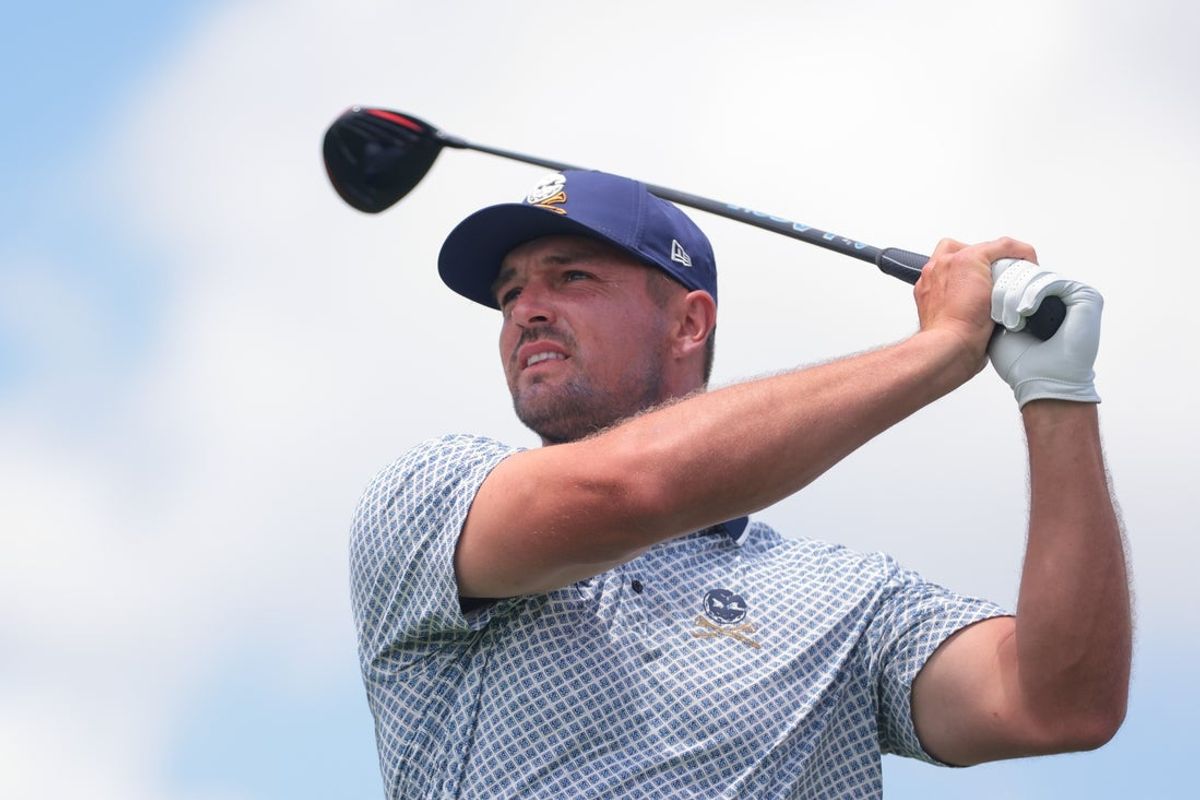 Apr 5, 2025; Miami, Florida, USA; Bryson DeChambeau plays his shot from the eighth tee during the second round of the LIV Golf Miami golf tournament at Trump National Doral. Mandatory Credit: Sam Navarro-Imagn Images