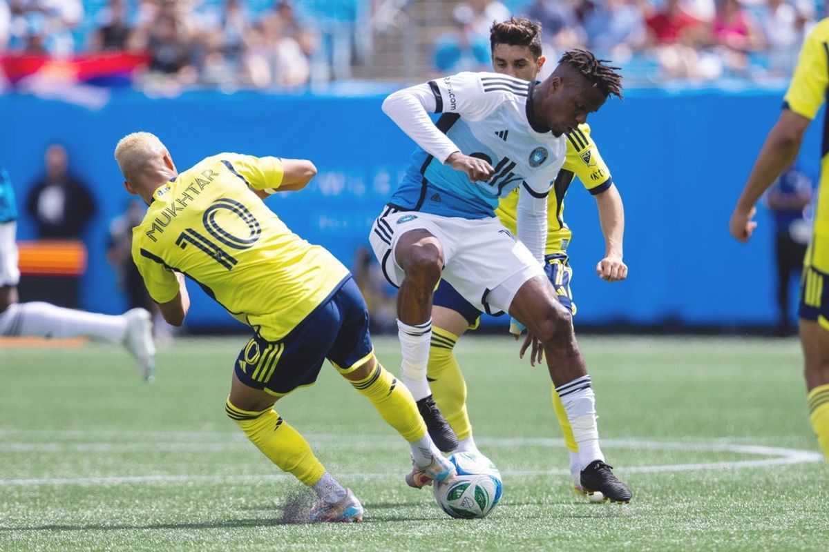 Apr 5, 2025; Charlotte, North Carolina, USA; Charlotte FC forward Wilfried Zaha (10) and Nashville SC midfielder Hany Mukhtar (10) battle during the first half at Bank of America Stadium. Mandatory Credit: Scott Kinser-Imagn Images
