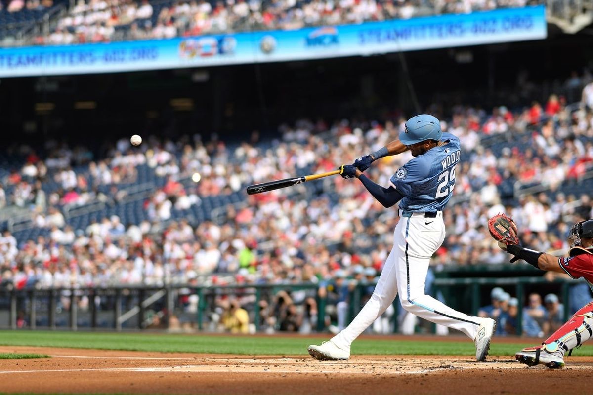 Apr 5, 2025; Washington, District of Columbia, USA; Washington Nationals outfielder James Wood (29) hits a double during the first inning against the Arizona Diamondbacks at Nationals Park. Mandatory Credit: Reggie Hildred-Imagn Images