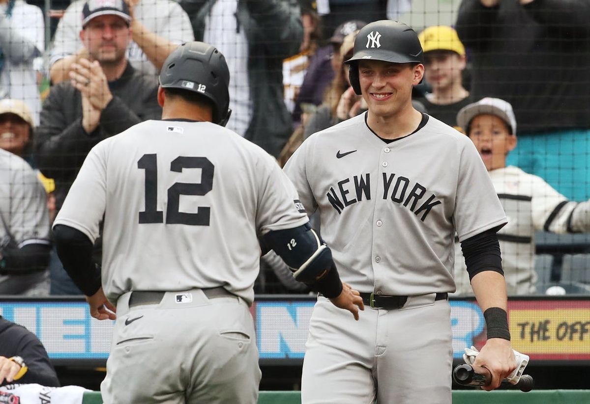 Apr 5, 2025; Pittsburgh, Pennsylvania, USA;  New York Yankees designated hitter Ben Rice (right) greets center fielder Trent Grisham (12) as he returns to the dugout after hitting a solo home run against the Pittsburgh Pirates during the third inning at PNC Park. Mandatory Credit: Charles LeClaire-Imagn Images