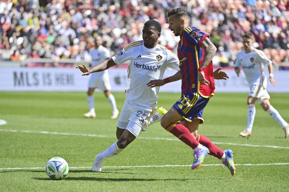 Apr 5, 2025; Sandy, Utah, USA; LA Galaxy defender Emiro Garces (25) steals the ball from Real Salt Lake midfielder Diogo Goncalves (10) during the first half at America First Field. Mandatory Credit: Christopher Creveling-Imagn Images