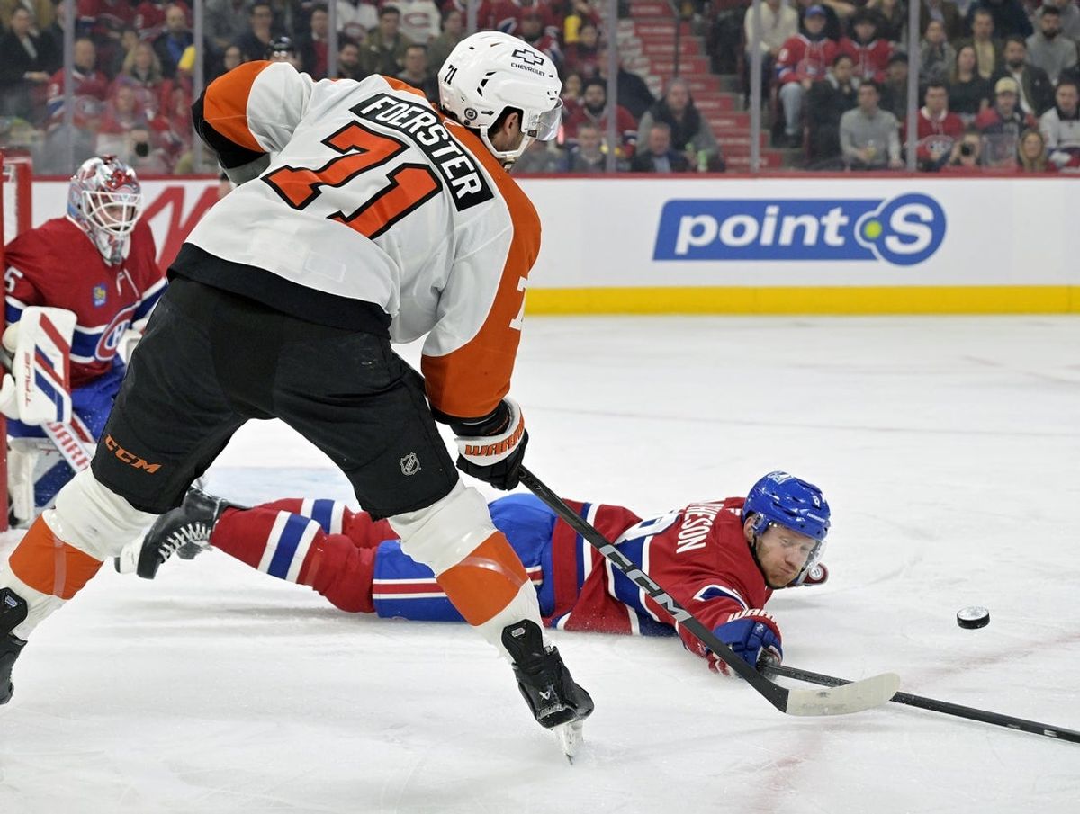 Apr 5, 2025; Montreal, Quebec, CAN; Montreal Canadiens defenseman Mike Matheson (8) attempts to pass by Philadelphia Flyers forward Tyson Foerster (71) during the first period at the Bell Centre. Mandatory Credit: Eric Bolte-Imagn Images