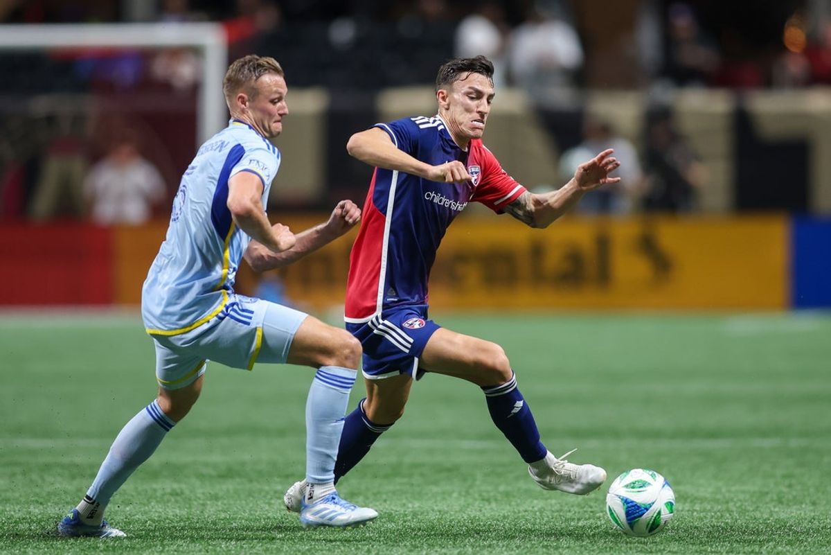 Apr 5, 2025; Atlanta, Georgia, USA; FC Dallas forward Petar Musa (9) is defended by Atlanta United defender Stian Gregersen (5) in the first half at Mercedes-Benz Stadium. Mandatory Credit: Brett Davis-Imagn Images