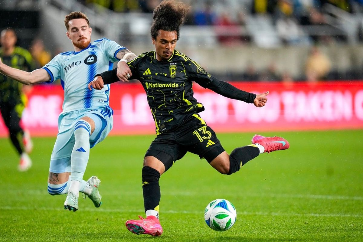 Columbus Crew midfielder Aziel Jackson (13) shoots and scores a goal against CF Montreal defender Joel Waterman (16) in the first half at Lower.com Field on Saturday, April 5, 2025 in Columbus, Ohio.