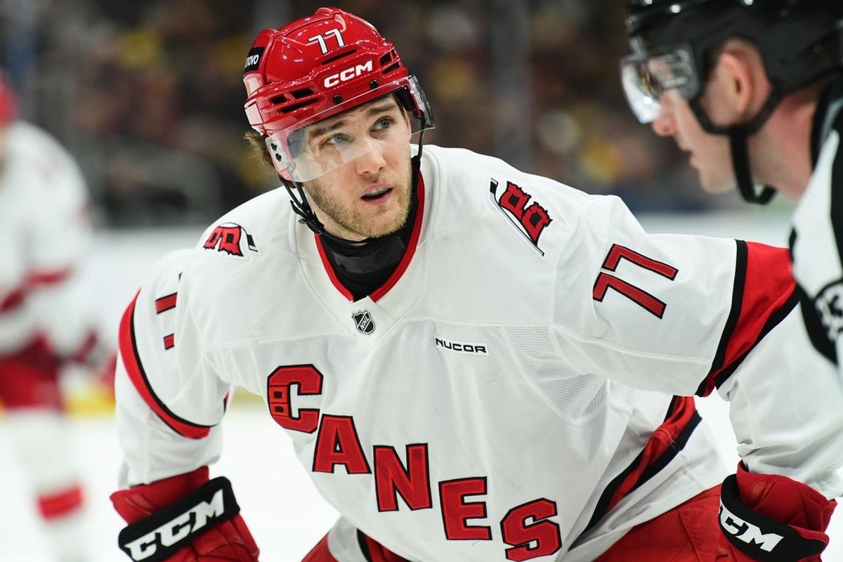Apr 5, 2025; Boston, Massachusetts, USA; Carolina Hurricanes center Mark Jankowski (77) gets set for a face-off during the second period against the Boston Bruins at TD Garden. Mandatory Credit: Bob DeChiara-Imagn Images