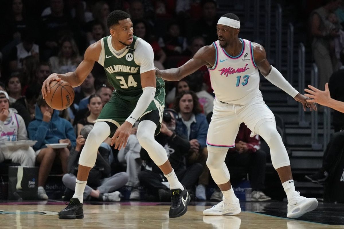 Apr 5, 2025; Miami, Florida, USA;  Milwaukee Bucks forward Giannis Antetokounmpo (34) looks to shoot as Miami Heat center Bam Adebayo (13) defends during the first half at Kaseya Center. Mandatory Credit: Jim Rassol-Imagn Images
