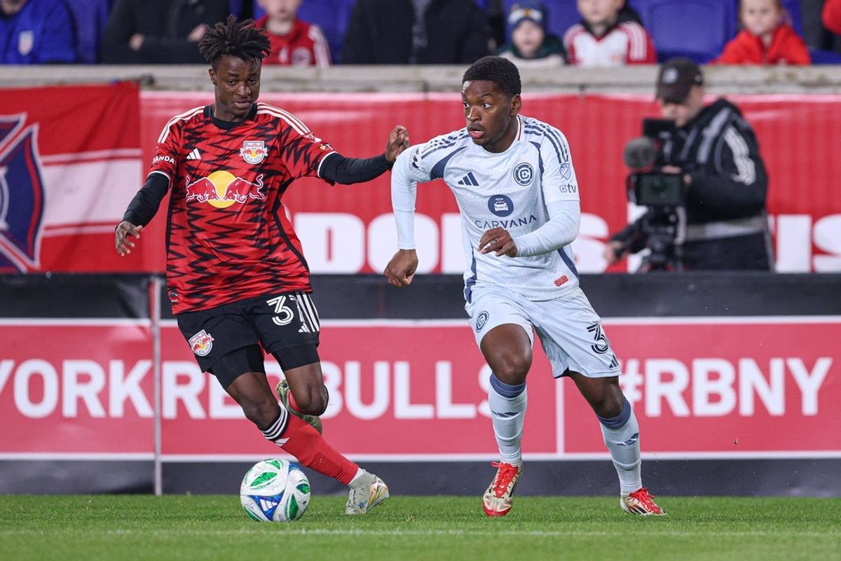 Apr 5, 2025; Harrison, New Jersey, USA; Chicago Fire FC defender Justin Reynolds (36) plays the ball against New York Red Bulls forward Mohammed Sofo (37) during the first half at Sports Illustrated Stadium. Mandatory Credit: Vincent Carchietta-Imagn Images