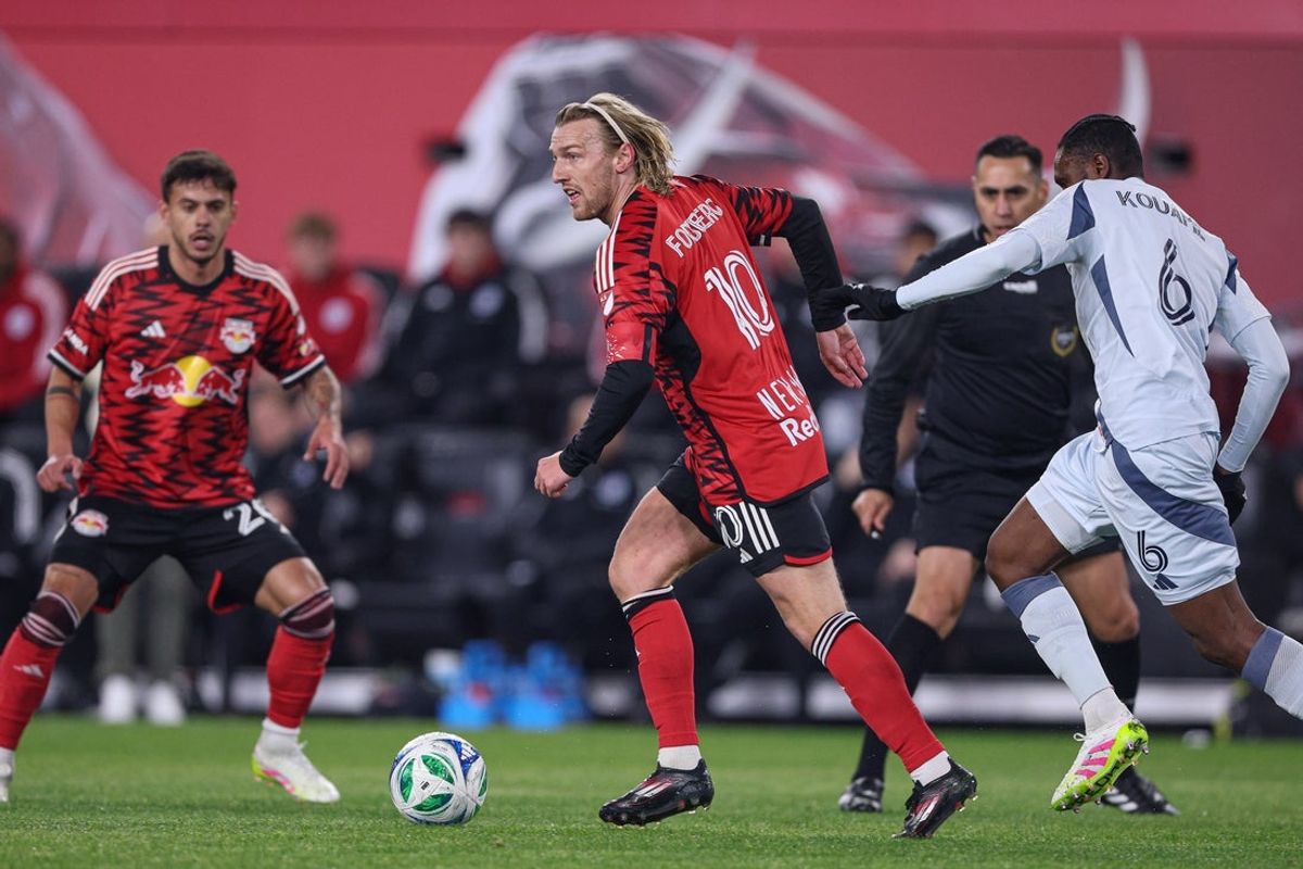 Apr 5, 2025; Harrison, New Jersey, USA; New York Red Bulls midfielder Emil Forsberg (10) controls the ball against Chicago Fire FC midfielder Rominigue Kouame (6) during the first half at Sports Illustrated Stadium. Mandatory Credit: Vincent Carchietta-Imagn Images