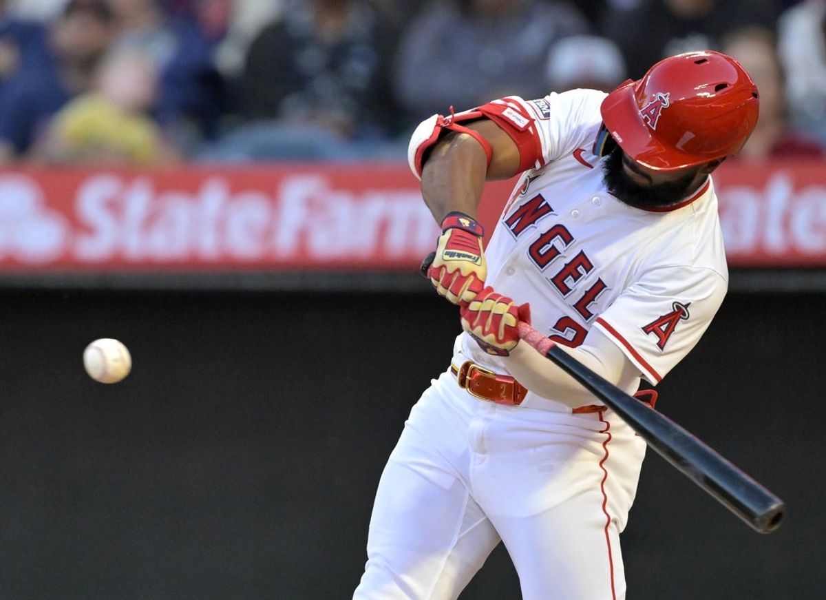 Apr 5, 2025; Anaheim, California, USA;  Los Angeles Angels third baseman Luis Rengifo (2) hits a solo home run in the first inning against the Cleveland Guardians at Angel Stadium. Mandatory Credit: Jayne Kamin-Oncea-Imagn Images