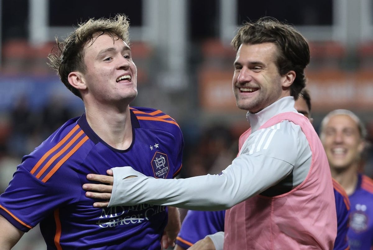 Apr 5, 2025; Houston, Texas, USA;  Houston Dynamo FC defender Ethan Bartlow (4) celebrates midfielder Jack McGlynn's (21) goal against the Los Angeles FC in the second half at Shell Energy Stadium. Mandatory Credit: Thomas Shea-Imagn Images