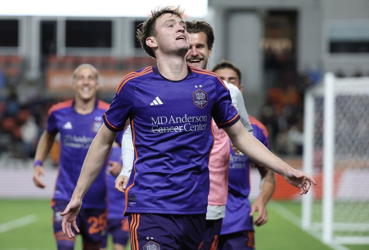 Apr 5, 2025; Houston, Texas, USA; Houston Dynamo FC midfielder Jack McGlynn (21) celebrates his goal against the Los Angeles FC  in the second half at Shell Energy Stadium. Mandatory Credit: Thomas Shea-Imagn Images