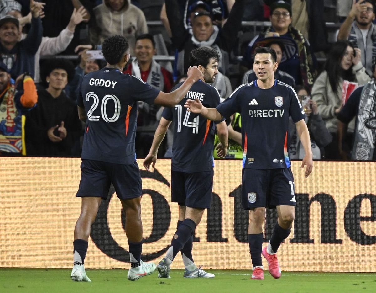 Apr 5, 2025; San Diego, California, USA; San Diego FC midfielder Hirving Lozano (11), right, and midfielder Anibal Godoy (20) celebrate after Lozano scored against the Seattle Sounders at Snapdragon Stadium. Mandatory Credit: Denis Poroy-Imagn Images