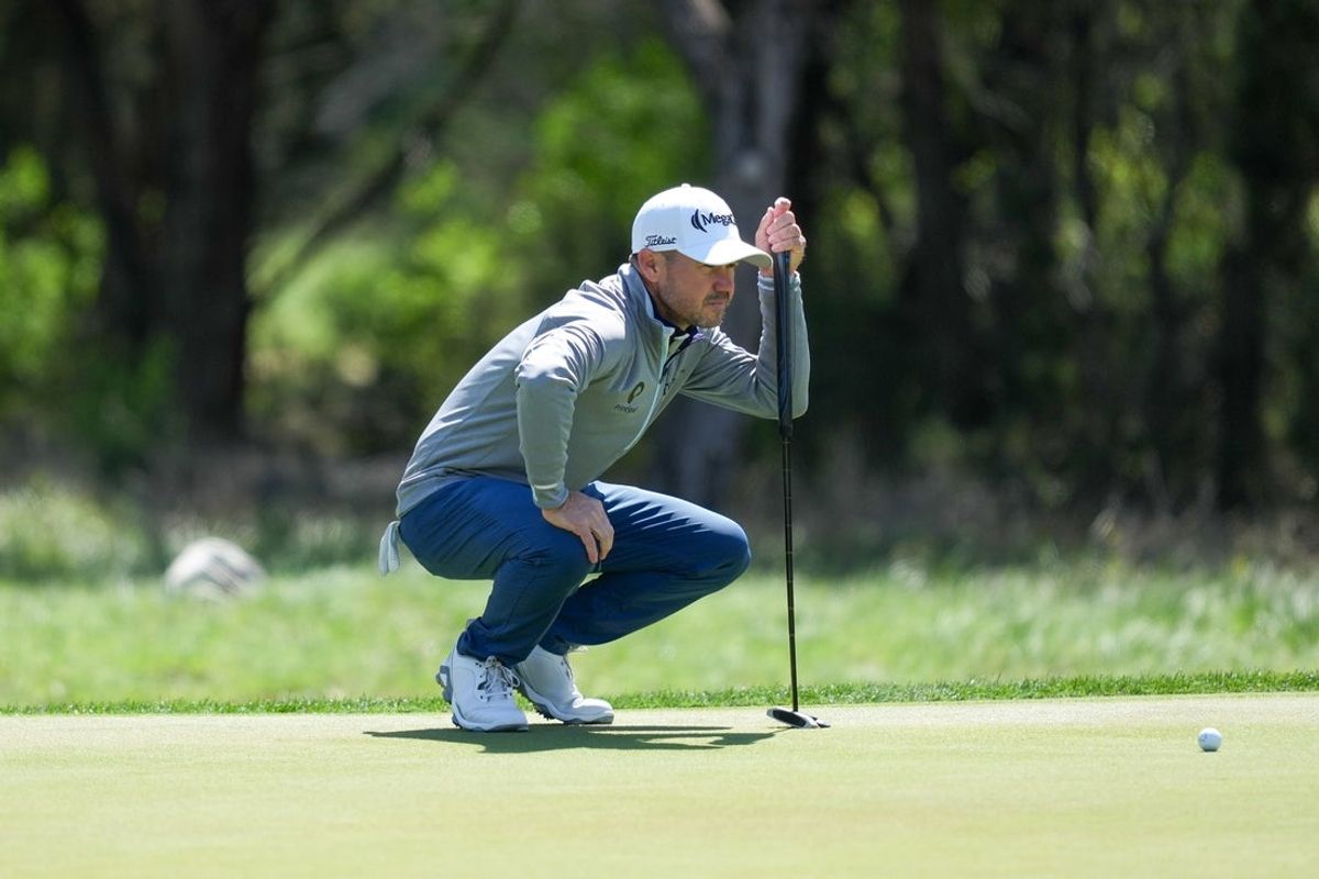 Apr 6, 2025; San Antonio, Texas, USA; Brian Harman lines up a putt on the first green during the final round of the Valero Texas Open golf tournament. Mandatory Credit: Daniel Dunn-Imagn Images