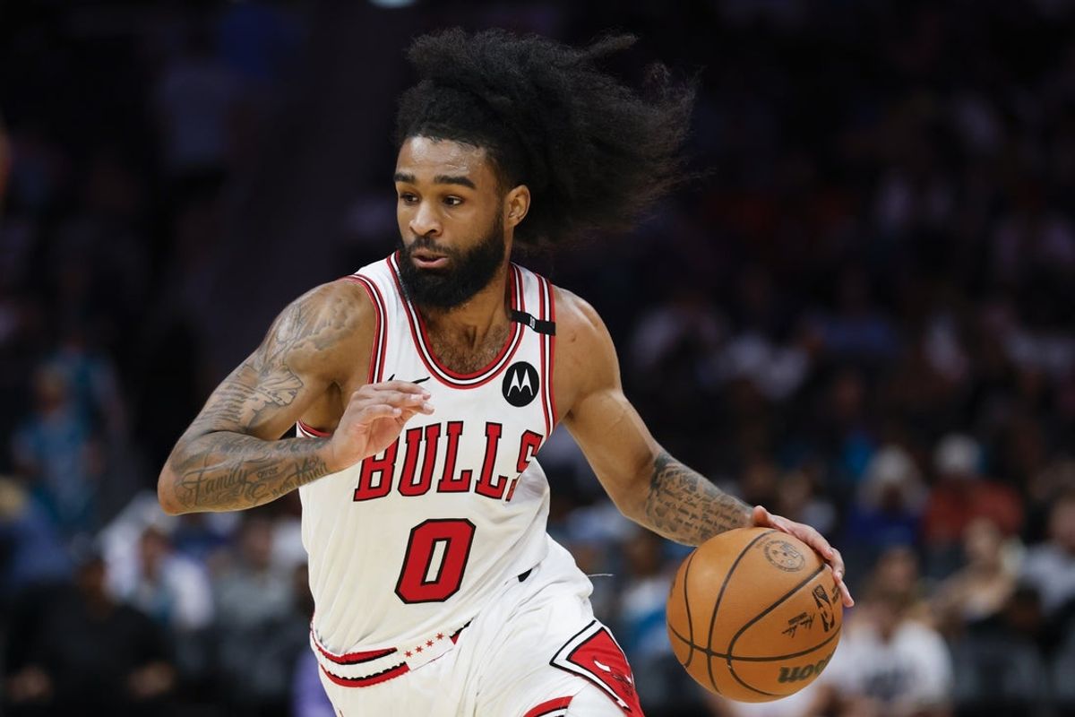 Apr 6, 2025; Charlotte, North Carolina, USA; Chicago Bulls guard Coby White (0) drives to the basket against the Charlotte Hornets during the second half at Spectrum Center. Mandatory Credit: Nell Redmond-Imagn Images