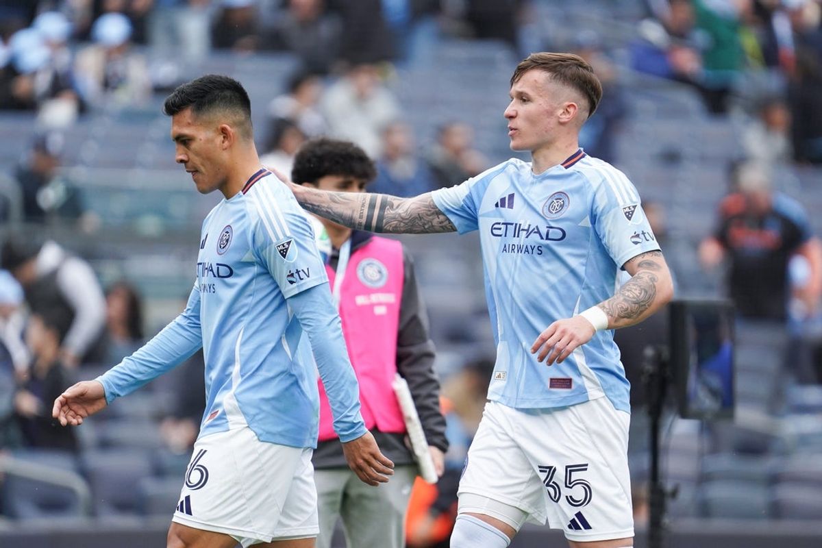 Apr 6, 2025; New York, New York, USA; New York City FC defender Mitja Ilenic (35) comforts New York City FC forward Alonso Martinez (16) after he bounced a penalty kick off the crossbar during the first half against Minnesota United at Yankee Stadium. Mandatory Credit: Lucas Boland-Imagn Images