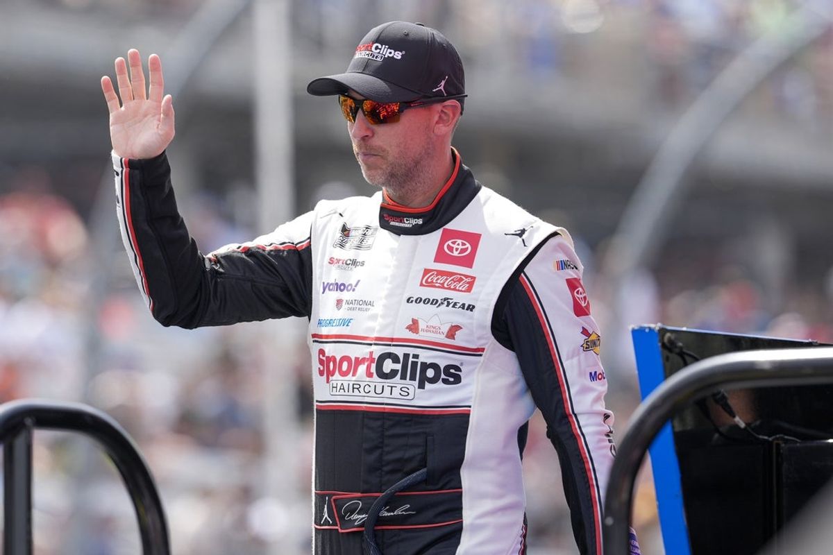Apr 6, 2025; Darlington, South Carolina, USA; NASCAR Cup Series driver Denny Hamlin (11) during intros during the Goodyear 400 at Darlington Raceway. Mandatory Credit: Jim Dedmon-Imagn Images