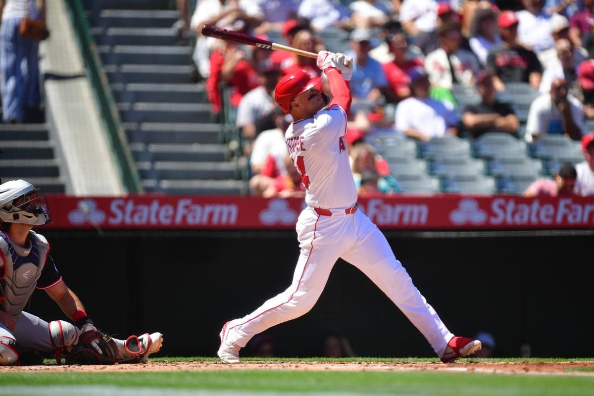 Apr 6, 2025; Anaheim, California, USA; Los Angeles Angels catcher Logan O'Hoppe (14) hits a solo home run against the Cleveland Guardians during the second inning at Angel Stadium. Mandatory Credit: Gary A. Vasquez-Imagn Images
