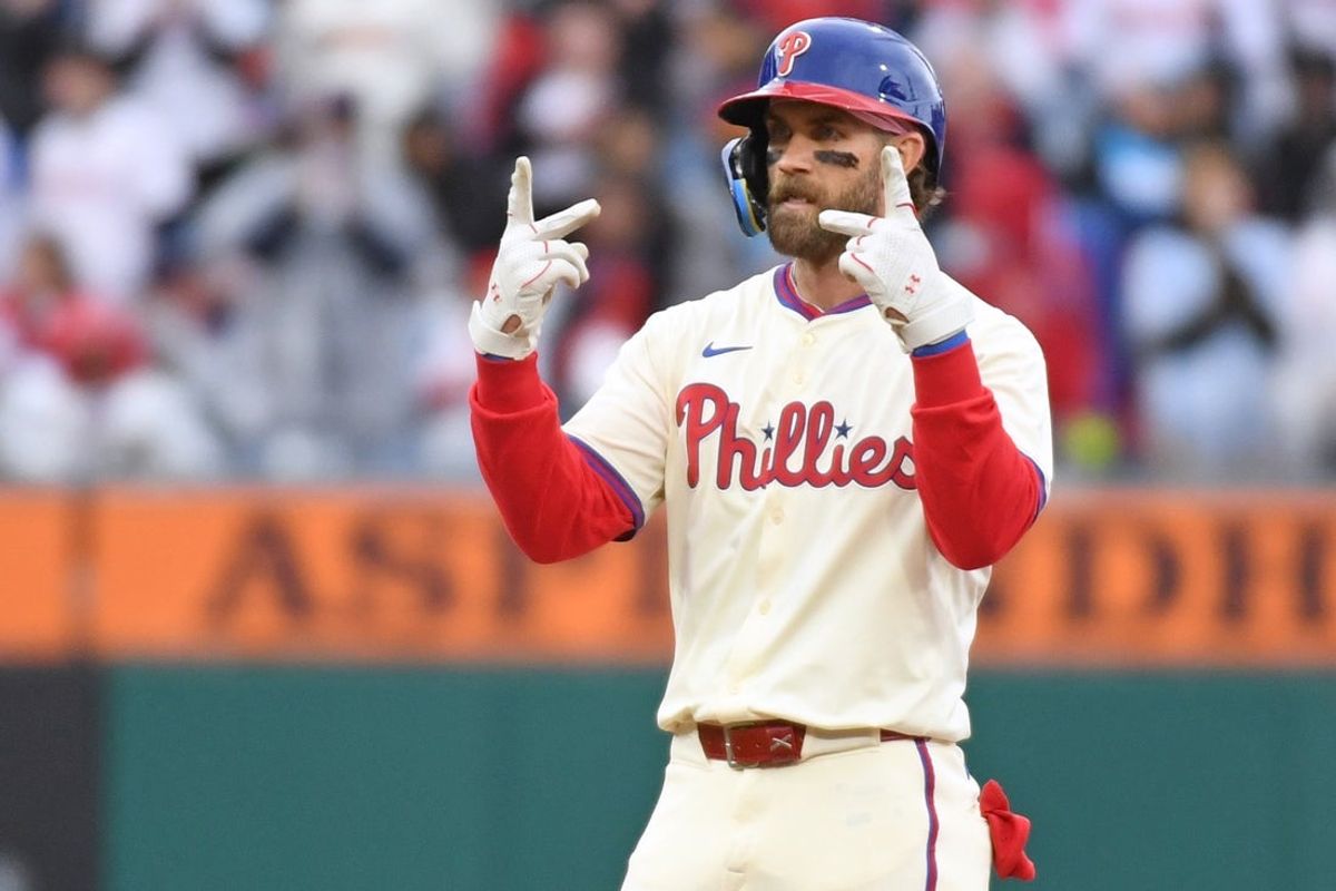 Apr 6, 2025; Philadelphia, Pennsylvania, USA; Philadelphia Phillies first base Bryce Harper (3) reacts after hitting a double during the seventh inning against the Los Angeles Dodgers at Citizens Bank Park. Mandatory Credit: Eric Hartline-Imagn Images