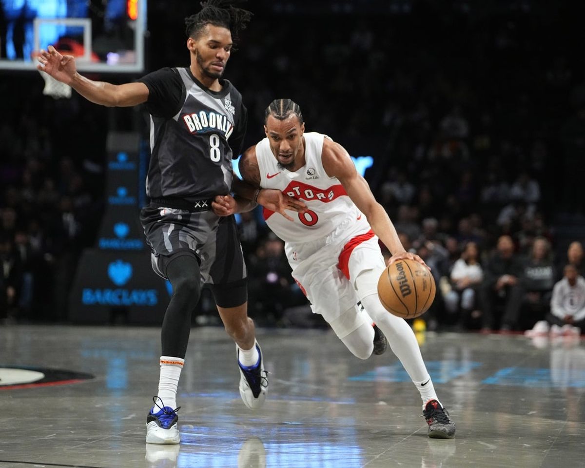 Apr 6, 2025; Brooklyn, New York, USA; Toronto Raptors guard A.J. Lawson (0) dribbles the ball against Brooklyn Nets forward Ziaire Williams (8) during the first half at Barclays Center. Mandatory Credit: Gregory Fisher-Imagn Images