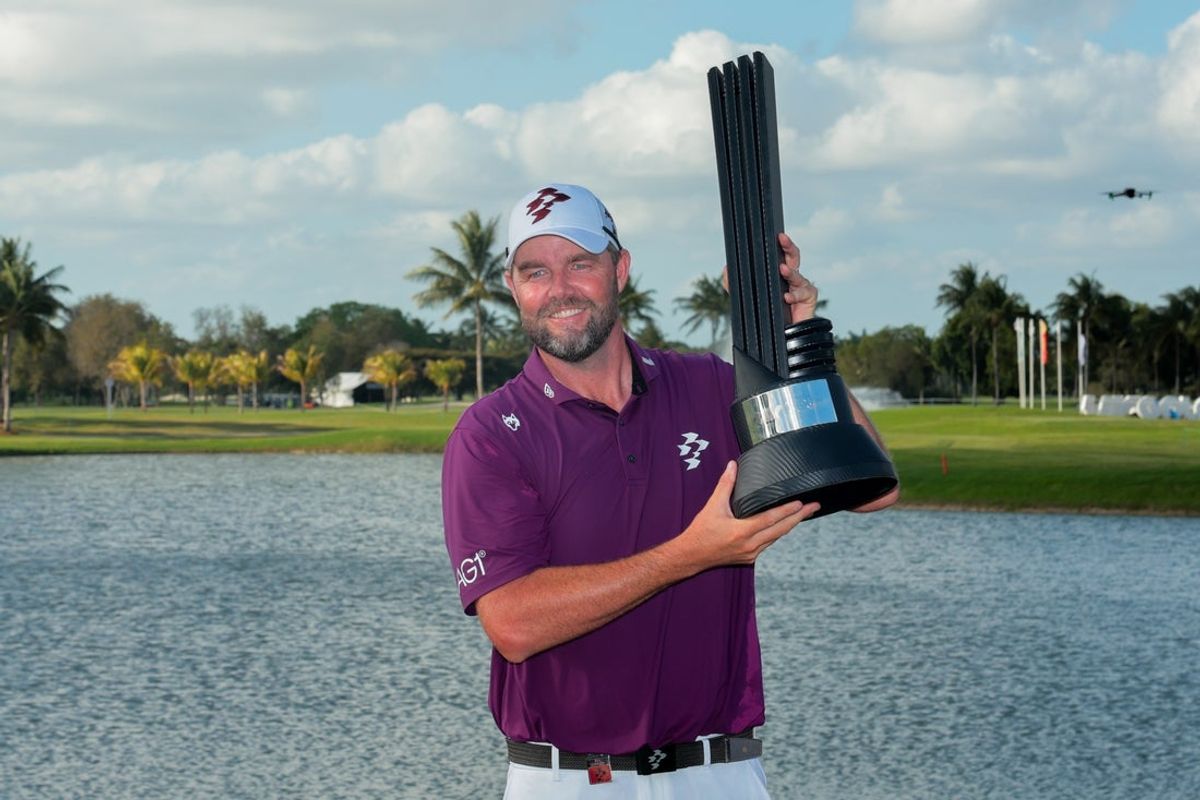 Apr 6, 2025; Miami, Florida, USA; Marc Leishman posses with the LIV Golf trophy after winning the final round of the LIV Golf Miami golf tournament at Trump National Doral. Mandatory Credit: Sam Navarro-Imagn Images