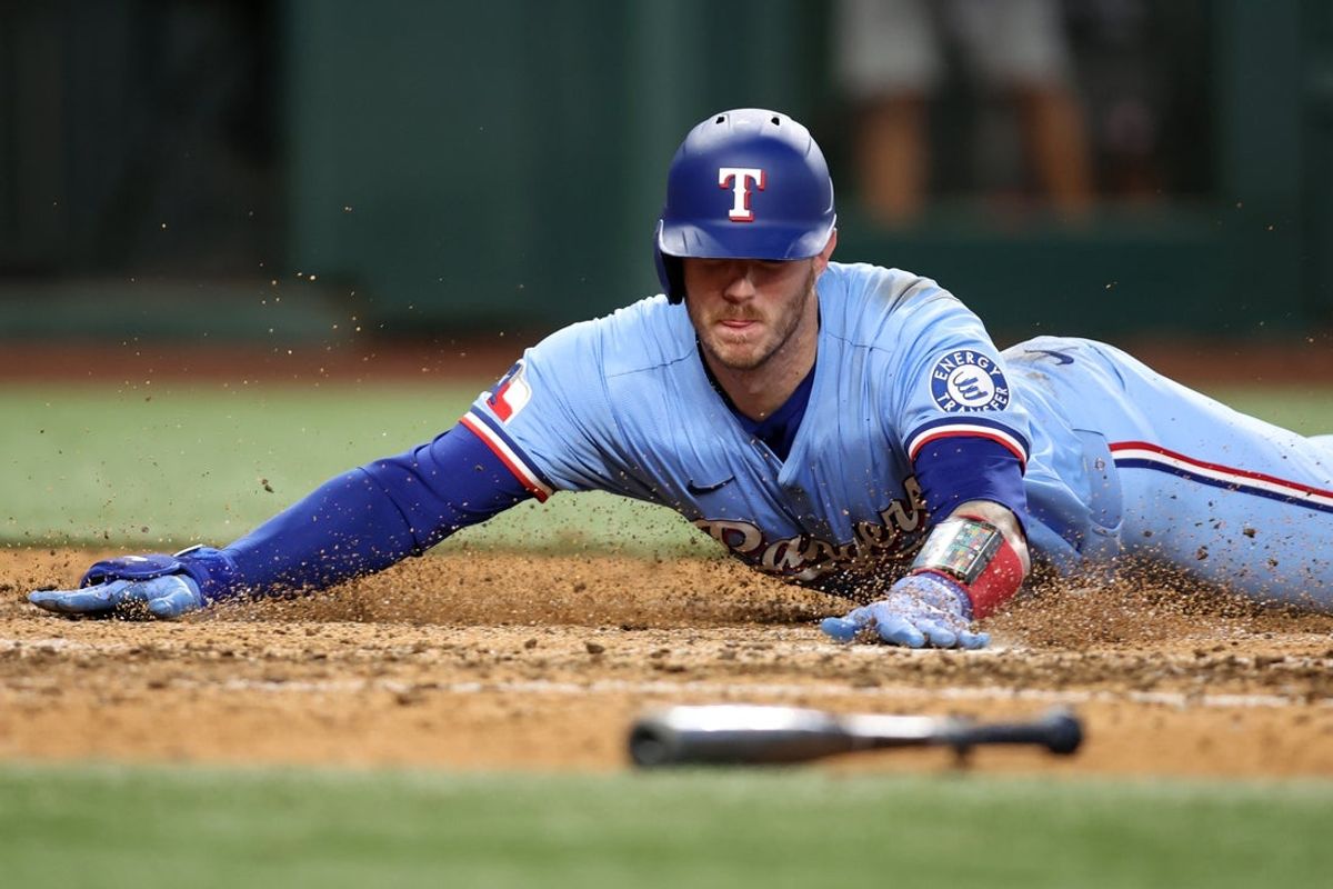 Apr 6, 2025; Arlington, Texas, USA; Texas Rangers catcher Jonah Heim (28) scores a run in the seventh inning against the Tampa Bay Rays at Globe Life Field. Mandatory Credit: Tim Heitman-Imagn Images