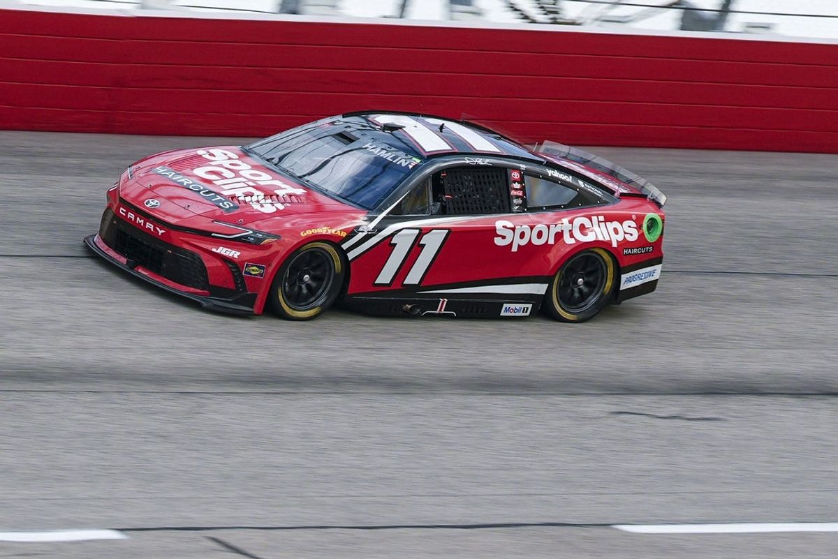 Apr 6, 2025; Darlington, South Carolina, USA; NASCAR Cup Series driver Denny Hamlin (11) during the Goodyear 400 at Darlington Raceway. Mandatory Credit: Jim Dedmon-Imagn Images