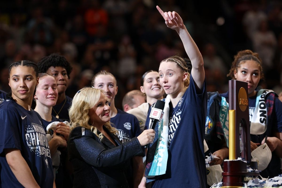 Apr 6, 2025; Tampa, FL, USA; Connecticut Huskies guard Paige Bueckers (5) is interviewed by ESPN reporter Holly Rowe after the national championship of the women's 2025 NCAA tournament against the South Carolina Gamecocks at Amalie Arena. Mandatory Credit: Nathan Ray Seebeck-Imagn Images