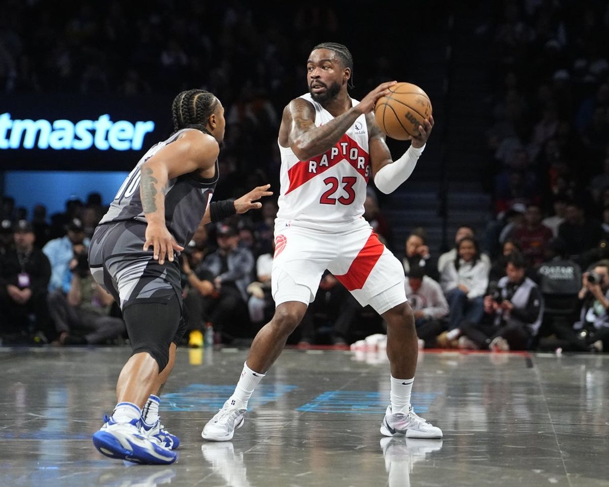 Apr 6, 2025; Brooklyn, New York, USA; Toronto Raptors guard Jamal Shead (23) looks to pass the ball against Brooklyn Nets guard Tyson Eitenne (10) during the first half at Barclays Center. Mandatory Credit: Gregory Fisher-Imagn Images