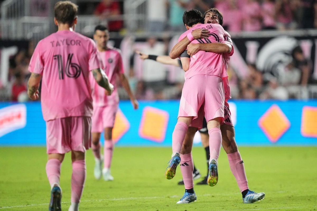 Apr 6, 2025; Fort Lauderdale, Florida, USA; Inter Miami midfielder Federico Redondo (55) hugs forward Lionel Messi (10) after Messi scored a goal late in the first half against the Toronto FC at Chase Stadium. Mandatory Credit: Jim Rassol-Imagn Images