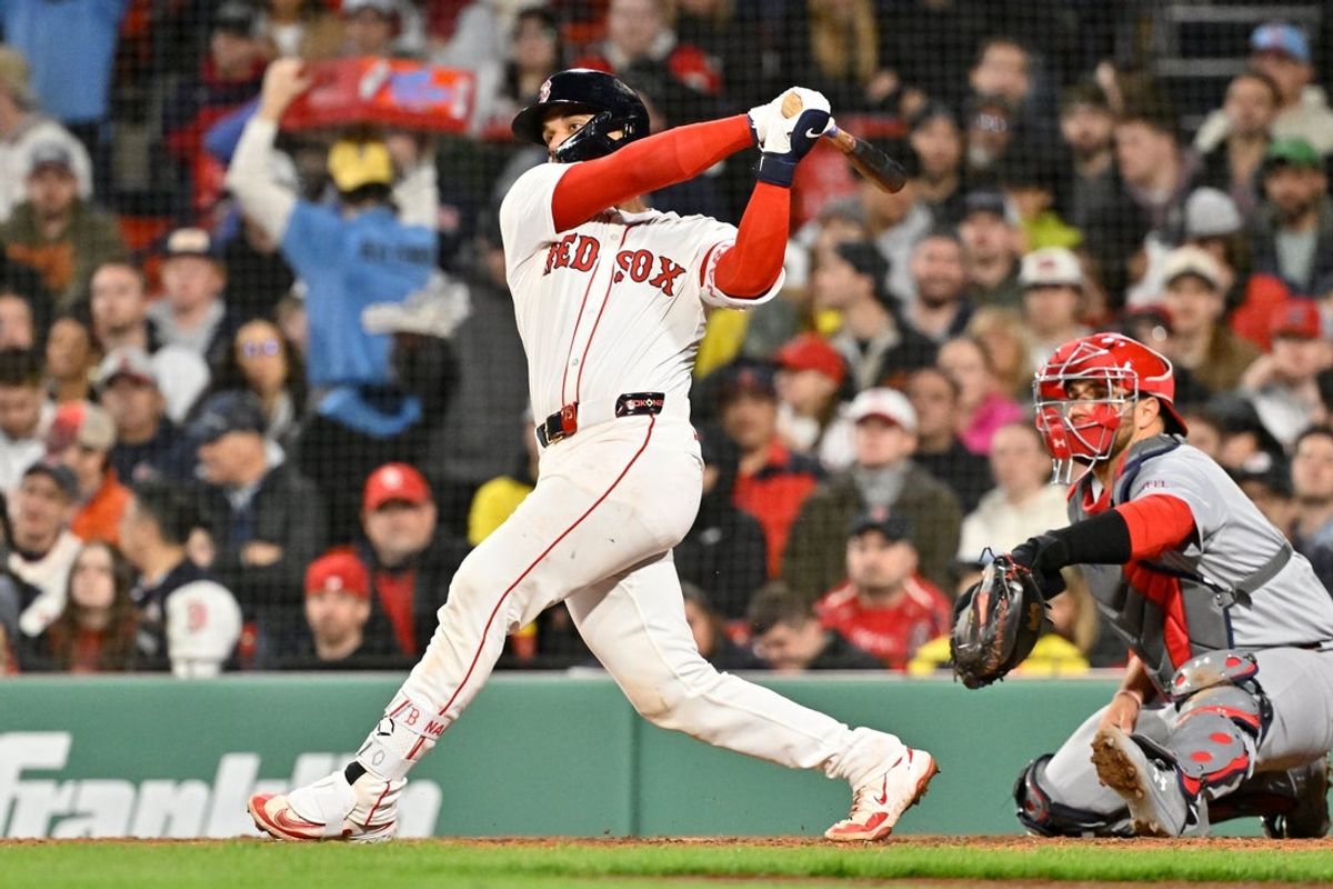 Apr 6, 2025; Boston, Massachusetts, USA; Boston Red Sox catcher Carlos Narvaez (75) hits an RBI single against the St. Louis Cardinals during the sixth inning at Fenway Park. Mandatory Credit: Eric Canha-Imagn Images