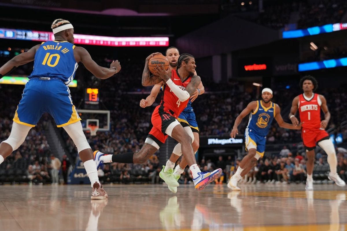 Apr 6, 2025; San Francisco, California, USA; Houston Rockets guard Jalen Green (4) drives past Golden State Warriors guard Stephen Curry (30) in the third quarter at the Chase Center. Mandatory Credit: Cary Edmondson-Imagn Images