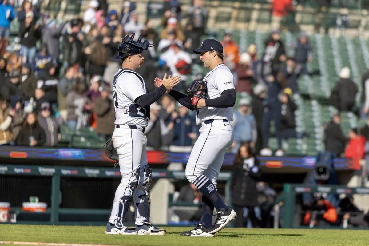 Apr 7, 2025; Detroit, Michigan, USA; Detroit Tigers catcher Jake Rogers (34) celebrates the win over the New York Yankees with pitcher Tommy Kahnle (43) at Comerica Park. Mandatory Credit: David Reginek-Imagn Images