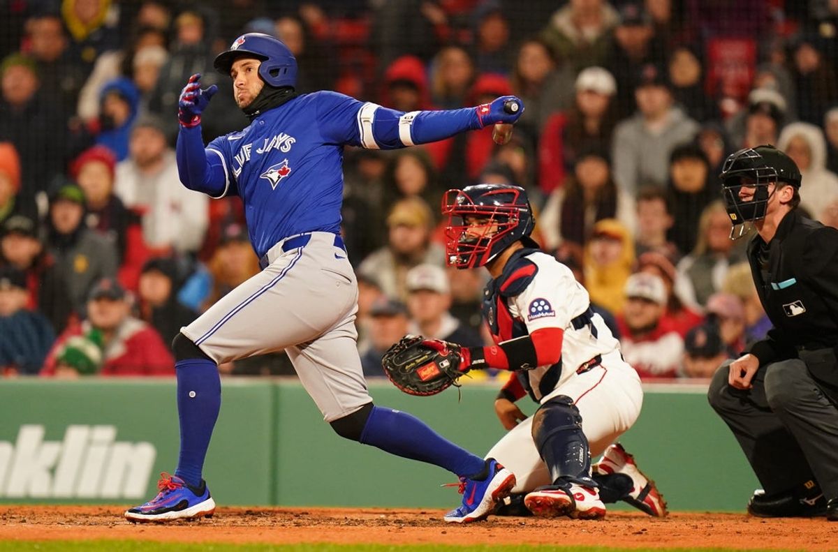 Apr 7, 2025; Boston, Massachusetts, USA; Toronto Blue Jays outfielder George Springer (4) singled to left field to drive in a run against the Boston Red Sox in the third inning at Fenway Park. Mandatory Credit: David Butler II-Imagn Images