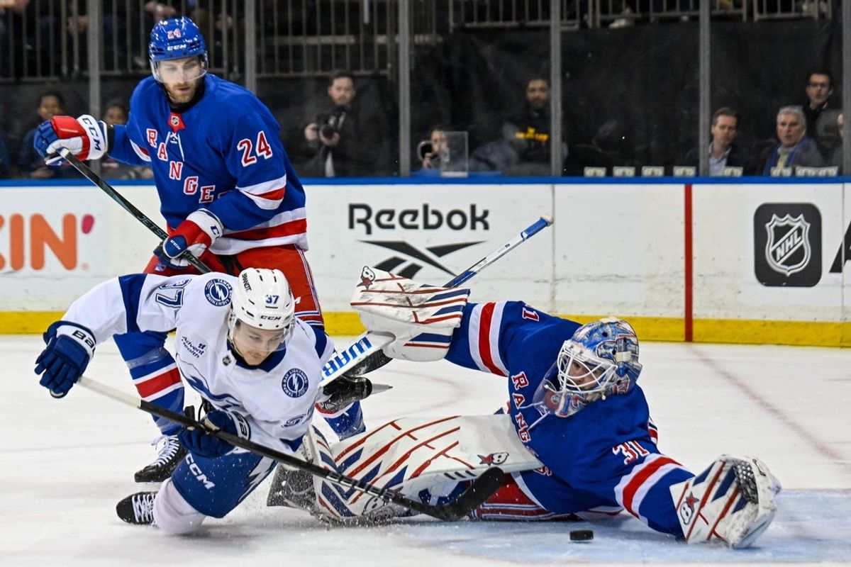 Apr 7, 2025; New York, New York, USA;  Tampa Bay Lightning center Yanni Gourde (37) shoots the puck on New York Rangers goaltender Igor Shesterkin (31) during the first period at Madison Square Garden. Mandatory Credit: Dennis Schneidler-Imagn Images