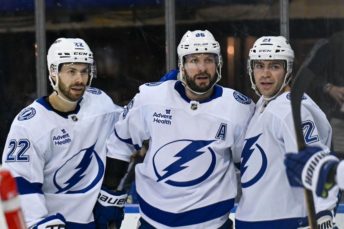 Apr 7, 2025; New York, New York, USA;  Tampa Bay Lightning center Brayden Point (21) celebrates his goal with Tampa Bay Lightning right wing Oliver Bjorkstrand (22) and Tampa Bay Lightning right wing Nikita Kucherov (86) against the New York Rangers during the first period at Madison Square Garden. Mandatory Credit: Dennis Schneidler-Imagn Images