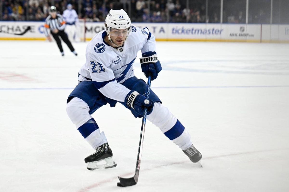 Apr 7, 2025; New York, New York, USA;  Tampa Bay Lightning center Brayden Point (21) skates with the puck against the New York Rangers during the first period at Madison Square Garden. Mandatory Credit: Dennis Schneidler-Imagn Images