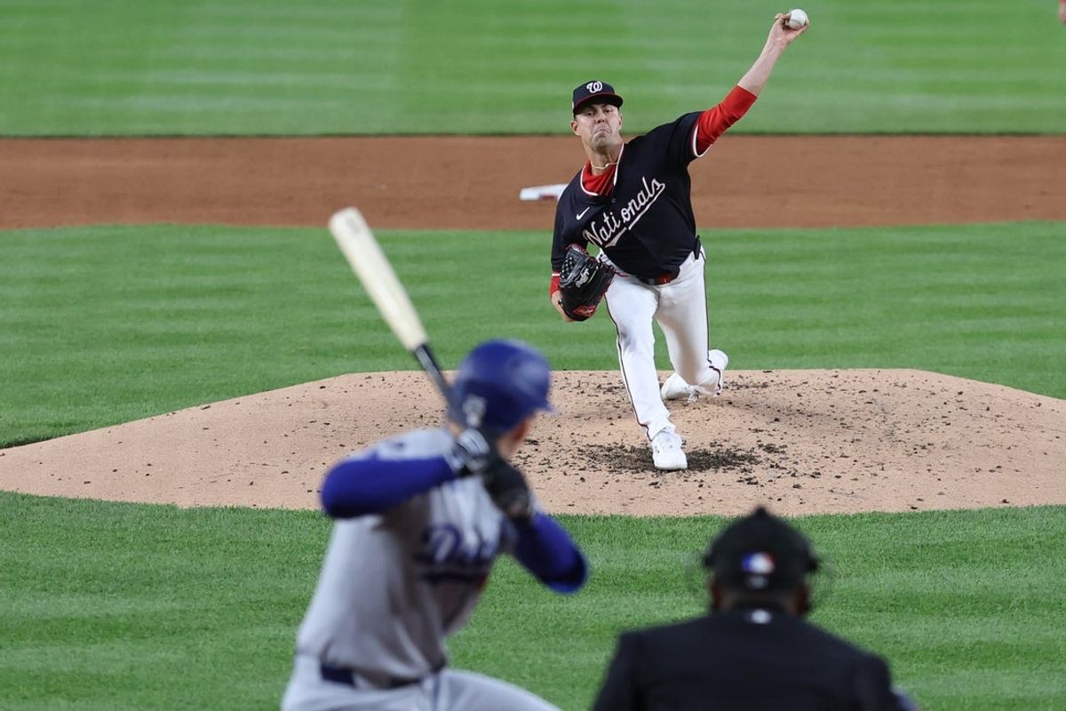 Apr 7, 2025; Washington, District of Columbia, USA; Washington Nationals pitcher MacKenzie Gore (1) pitches against Los Angeles Dodgers outfielder Tommy Edman (25) during the third inning at Nationals Park. Mandatory Credit: Geoff Burke-Imagn Images
