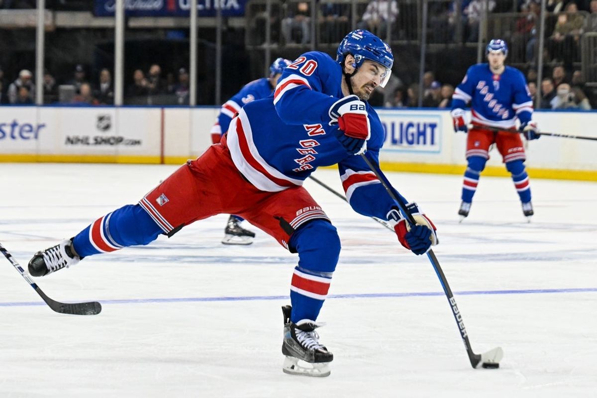 Apr 7, 2025; New York, New York, USA;  New York Rangers left wing Chris Kreider (20) attempts a shot against the Tampa Bay Lightning during the second period at Madison Square Garden. Mandatory Credit: Dennis Schneidler-Imagn Images