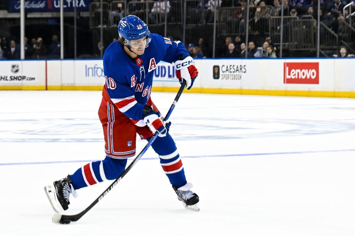 Apr 7, 2025; New York, New York, USA;  New York Rangers left wing Artemi Panarin (10) attempts a shot against the Tampa Bay Lightning during the second period at Madison Square Garden. Mandatory Credit: Dennis Schneidler-Imagn Images