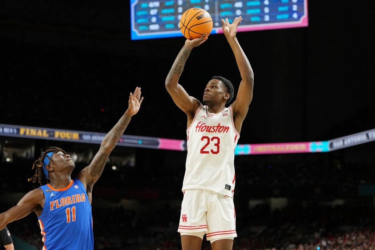 Apr 7, 2025; San Antonio, TX, USA; Houston Cougars guard Terrance Arceneaux (23) shoots the ball against Florida Gators guard Denzel Aberdeen (11) during the first half of the national championship game of the Final Four of the 2025 NCAA Tournament at the Alamodome. Mandatory Credit: Bob Donnan-Imagn Images
