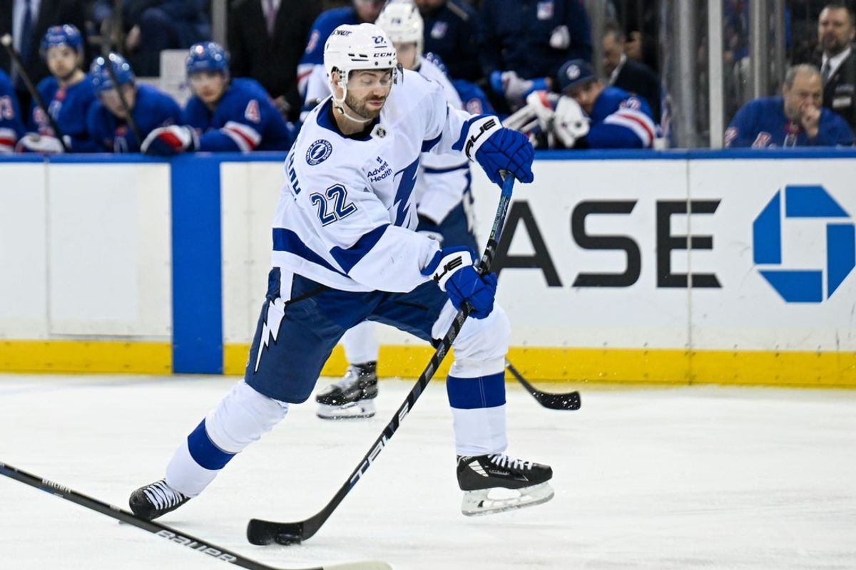 Apr 7, 2025; New York, New York, USA;  Tampa Bay Lightning right wing Oliver Bjorkstrand (22) attempts a shot against the New York Rangers during the third period at Madison Square Garden. Mandatory Credit: Dennis Schneidler-Imagn Images