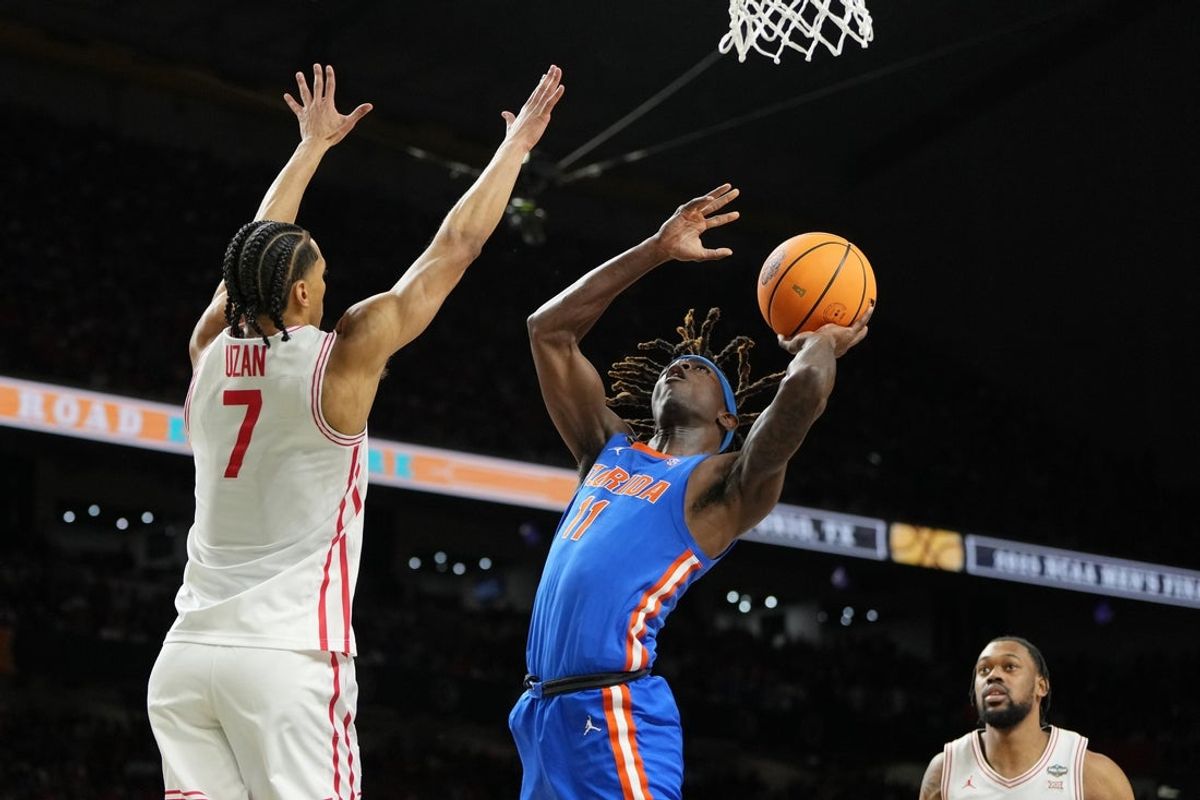 Apr 7, 2025; San Antonio, TX, USA; Florida Gators guard Denzel Aberdeen (11) shoots the ball against Houston Cougars guard Milos Uzan (7) during the second half of the national championship game of the Final Four of the 2025 NCAA Tournament at the Alamodome. Mandatory Credit: Bob Donnan-Imagn Images