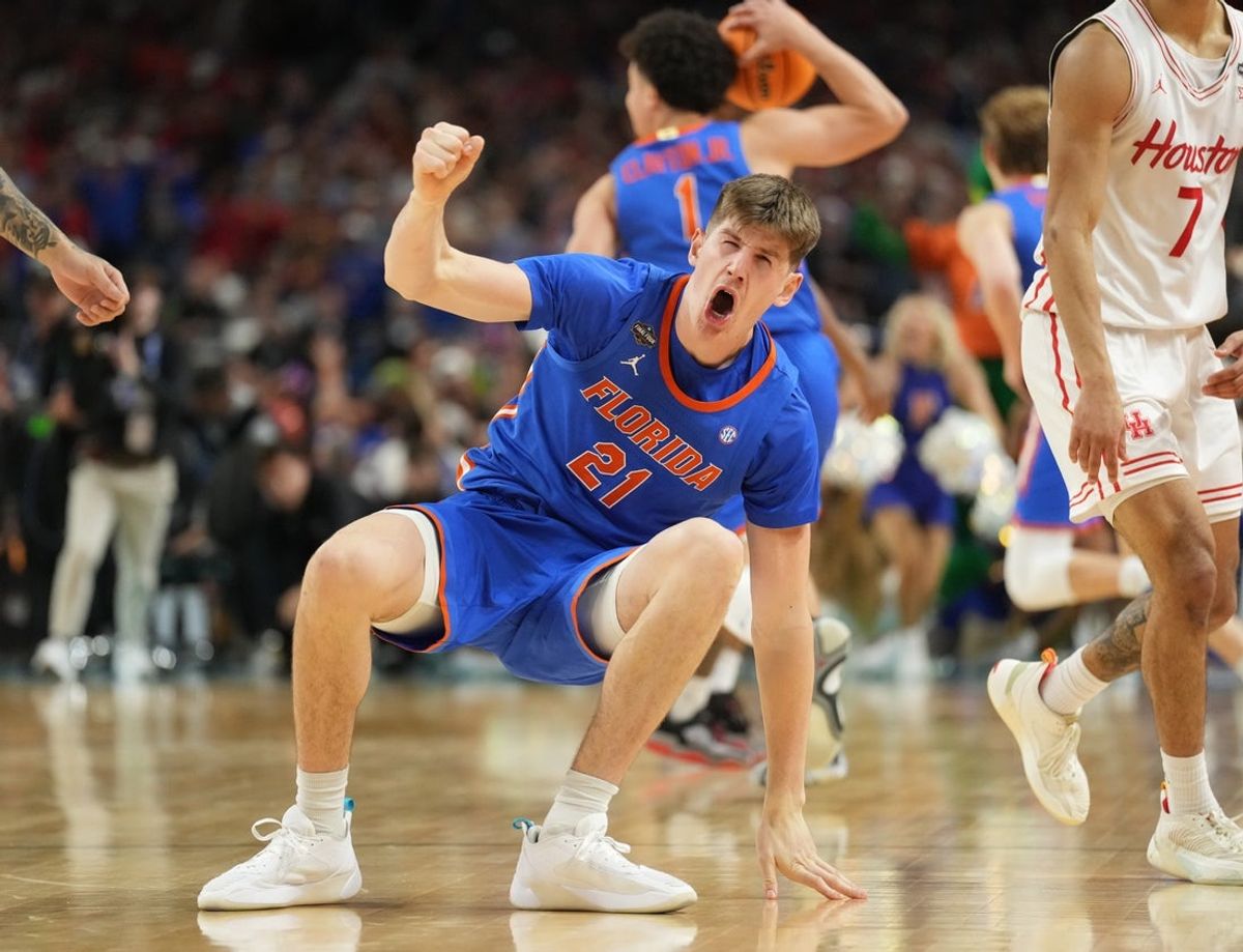 Apr 7, 2025; San Antonio, TX, USA;  Florida Gators forward Alex Condon (21) celebrates after defeating the Houston Cougars in the national championship game of the Final Four of the 2025 NCAA Tournament at the Alamodome. Mandatory Credit: Robert Deutsch-Imagn Images