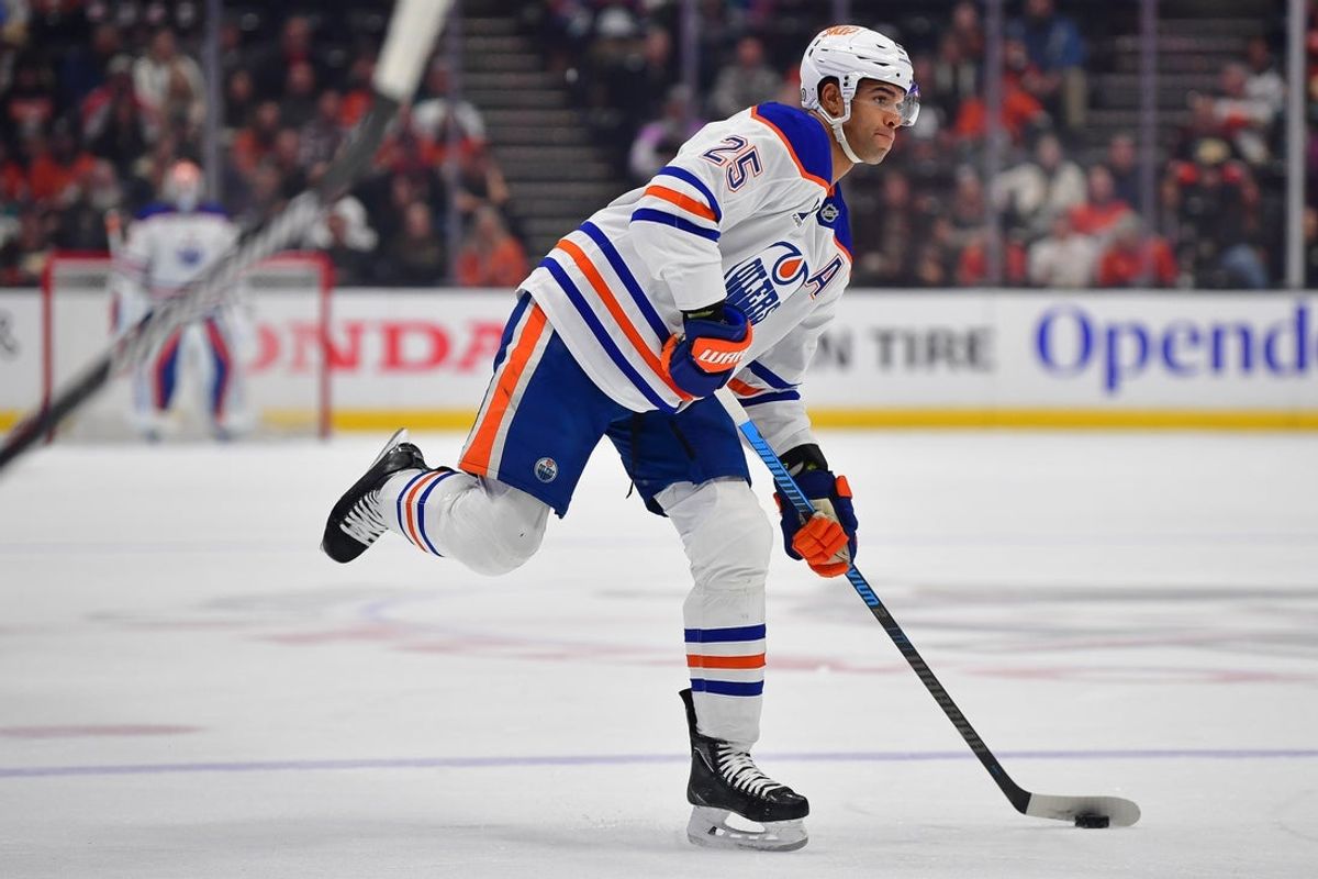 Apr 7, 2025; Anaheim, California, USA; Edmonton Oilers defenseman Darnell Nurse (25) shoots against the Anaheim Ducks during the first period at Honda Center. Mandatory Credit: Gary A. Vasquez-Imagn Images