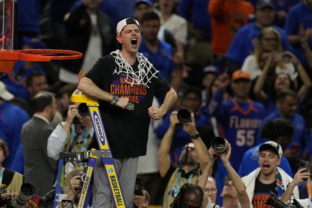 Apr 7, 2025; San Antonio, TX, USA; Florida Gators head coach Todd Golden reacts after cutting the net in the national championship game of the Final Four of the 2025 NCAA Tournament at the Alamodome.Mandatory Credit: Scott Wachter-Imagn Images