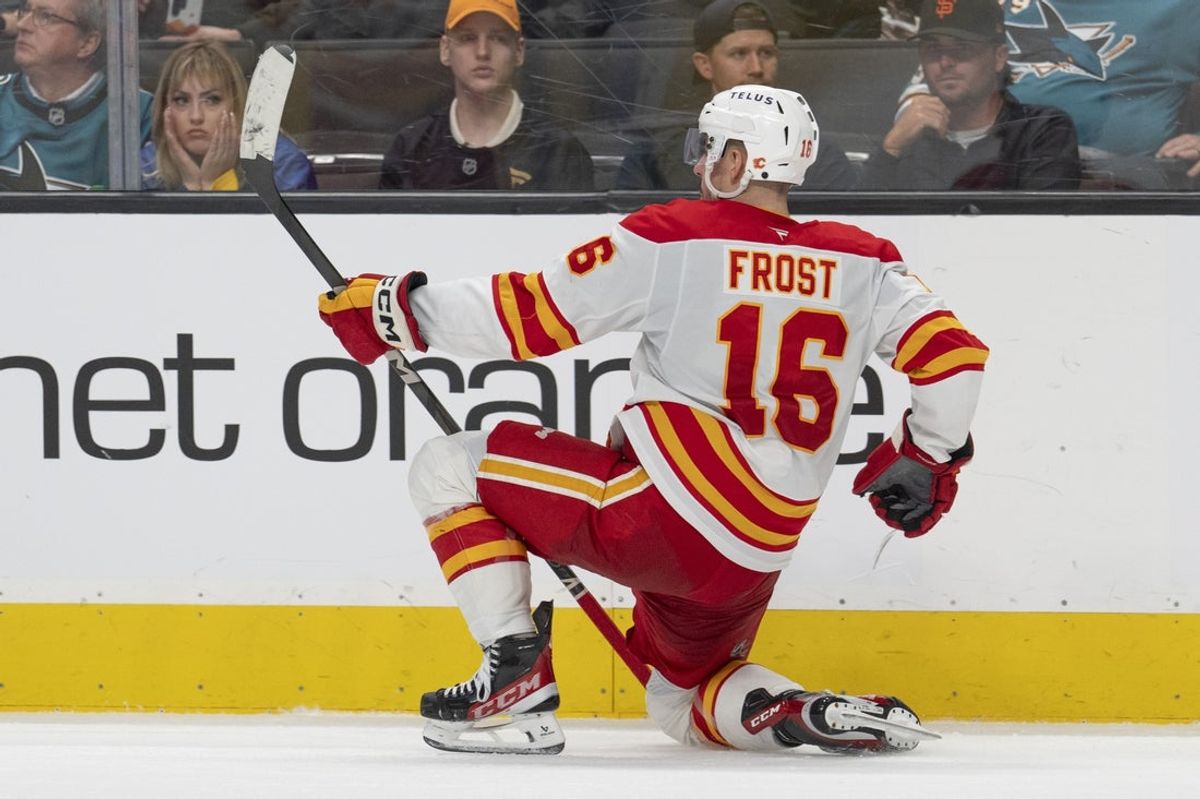 Apr 7, 2025; San Jose, California, USA;  Calgary Flames center Morgan Frost (16) celebrates after scoring a goal during the third period against the San Jose Sharks at SAP Center at San Jose. Mandatory Credit: Stan Szeto-Imagn Images
