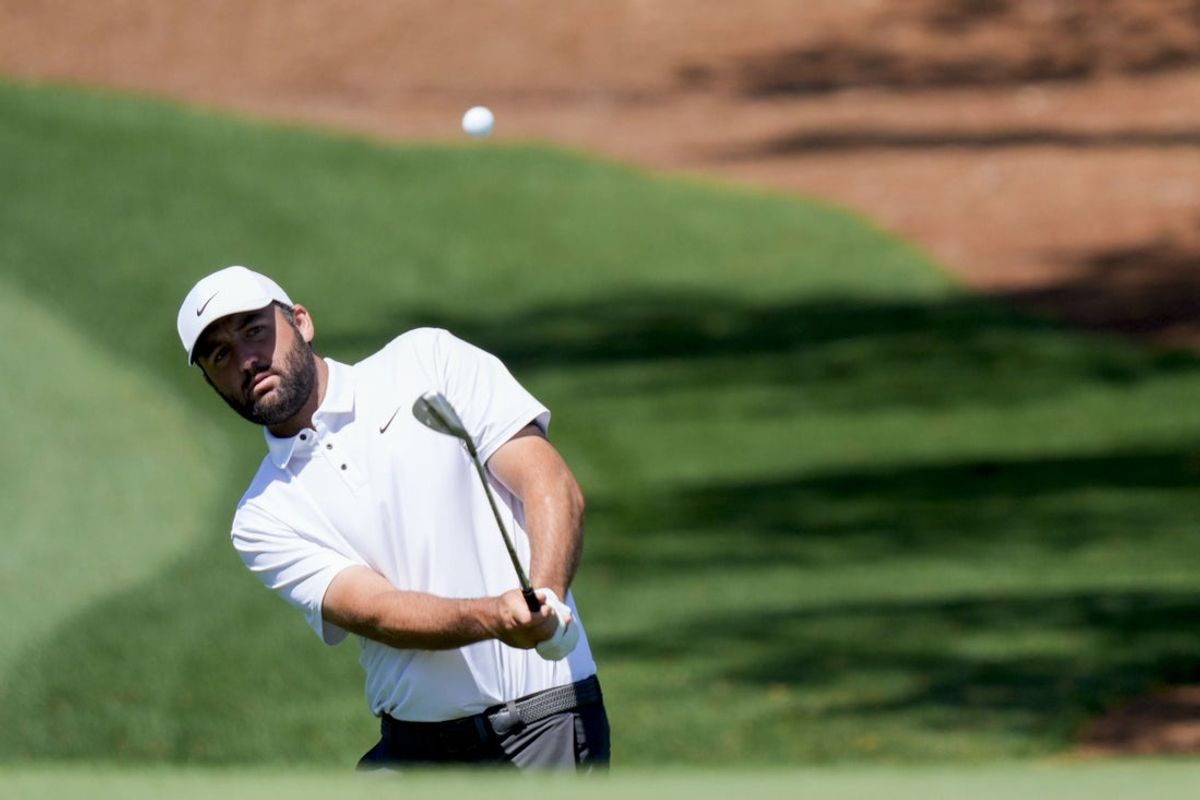 Apr 8, 2025; Augusta, Georgia, USA; Scottie Scheffler hit on no. 7 during a practice round for the Masters Tournament at Augusta National Golf Club. Mandatory Credit: Katie Goodale-Imagn Images